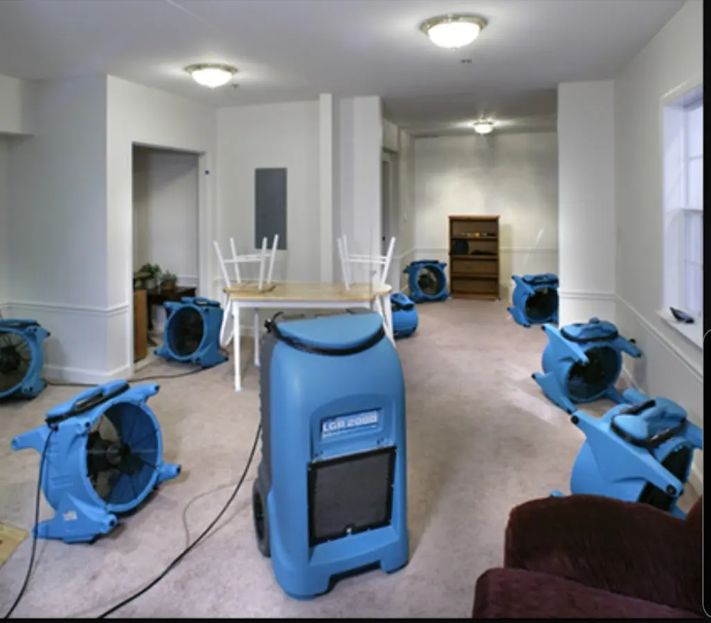 Air movers and dehumidifier setup for Water Damage Restoration in Kingsbury